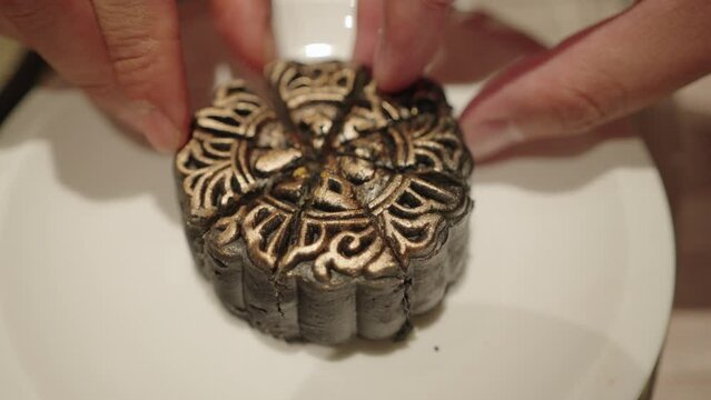 A mooncake is a Chinese bakery product traditionally eaten during the Mid-Autumn Festival