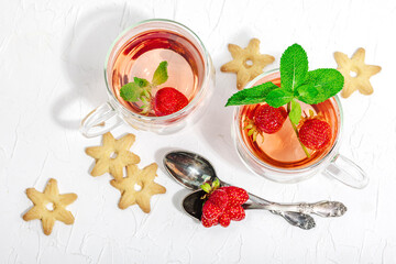 Strawberry tea concept. Good morning concept. Teapot, ripe fruits, healthy beverage