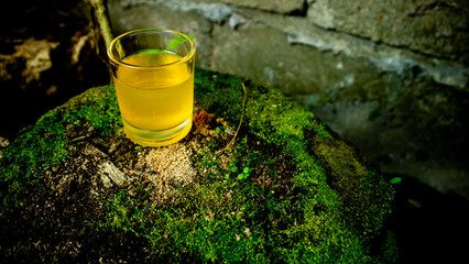 nice yellow colored drink in the glass