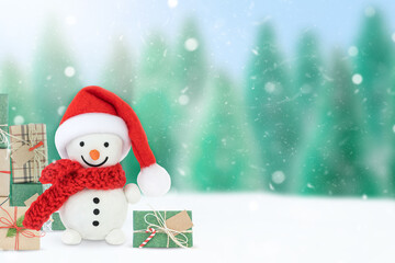 Christmas winter background with snowman, forest and gift boxes 