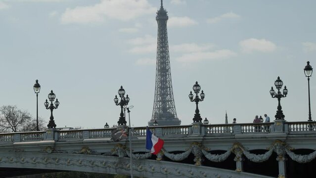 Eiffeltower in Paris with french flag next to pirate flag
