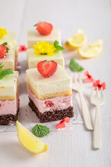 Obraz na płótnie Canvas Tasty strawberry sponge cake with berries and lemon.