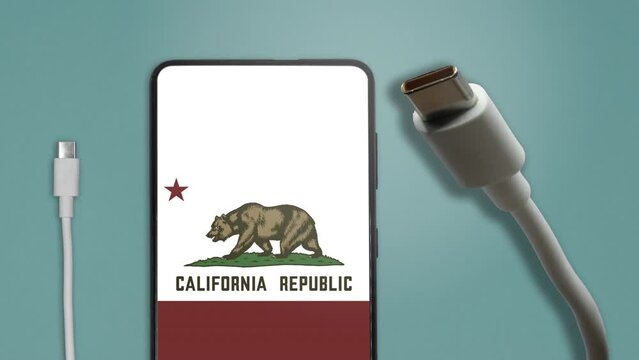 USB-C cable and a smartphone with the Californian Flag on screen