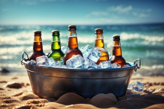 Green beer bottles in ice bucket on summer beach
