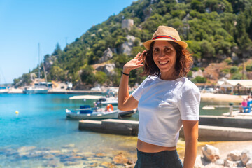 Fototapeta premium Portrait a woman in the fishing village of Frikes on the island of Ithaki or Ithaca, Ionian sea, Greece