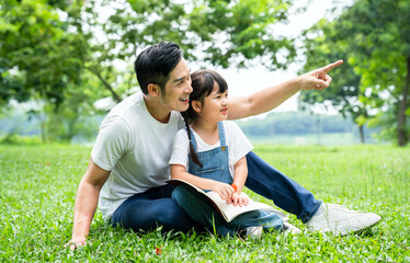 image of father and daughter playing in the park