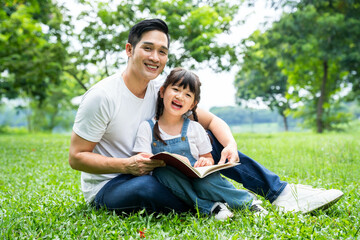 image of father and daughter playing in the park