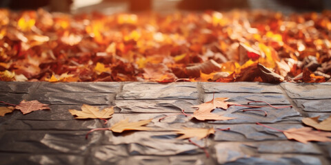 Empty stone texture table. Blurred autumn falling leaves background