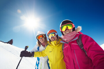 Fototapeta na wymiar funny skiers ride on snowy slope