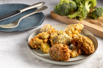 Fried breaded broccoli on the table.