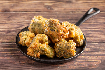 Fried breaded broccoli on the table.