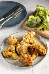 Fried breaded broccoli on the table.