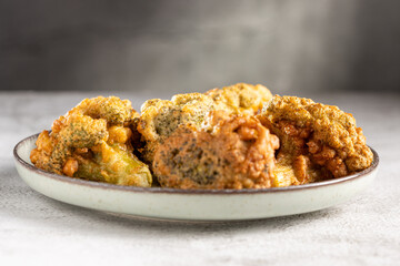 Fried breaded broccoli on the table.