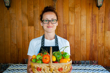 woman farmer offer vegetable harvest. organic food and eco farming. greengrocer woman outdoor....