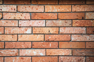 Old brick wall, old texture of red stone blocks closeup