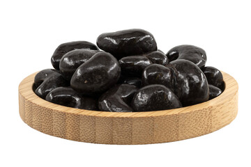 dark chocolate cashew dragees in a wooden bowl