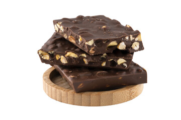 milk chocolate with pistachios in a wooden bowl