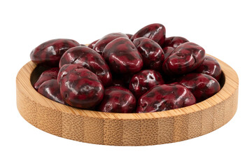 raspberry almond dragees in a wooden bowl