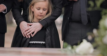 Death, funeral and child at coffin with flower, family and sad girl at service in graveyard for respect. Roses, loss and people mourning at wood casket in cemetery with kid crying at grave for burial