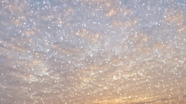 sky timelapse of snowfall on beautiful sunrise bg - loop video