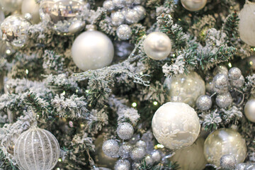 Background of shiny Christmas garland and balls on the Christmas tree