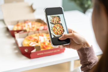 Happy meal, enjoy eating beautiful asian young woman taking photo of pizza in box by mobile smart...
