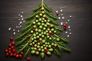  Christmas tree from Fresh green red olives fruits with green leaves on wooden table © nnattalli
