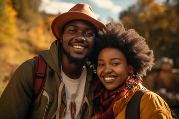Abwaschbare Fototapete Brügge a beautiful young african couple posing for a photo on a forest walk on a vacation in autumn