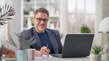 Man working with computer at home - businessman in home office