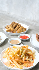 Crispy Delights Platter: Chicken Skin, Fried Mushroom, Bakso Tahu Special, and French Fries