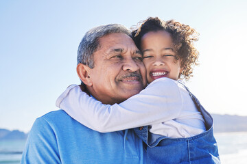 Grandfather, child and happy at the beach for vacation and travel together on outdoor holiday for happiness. Hug, smile and grandparent with kid or young grandchild by the ocean or sea for adventure - Powered by Adobe