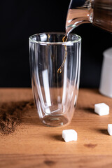 coffee being poured in a glass