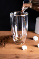 coffee being poured in a glass