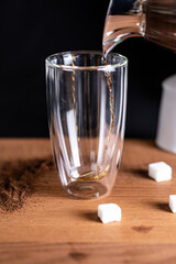 coffee being poured in a glass