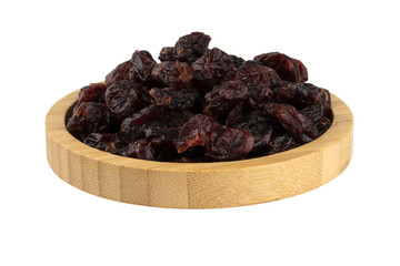 pitted dried blueberries in a wooden bowl