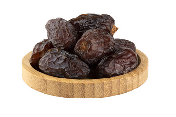 small dates in a wooden bowl