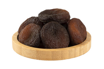 sun dried apricots in a wooden bowl