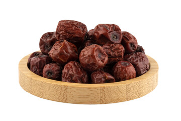 sun dried jujubes ina wooden bowl