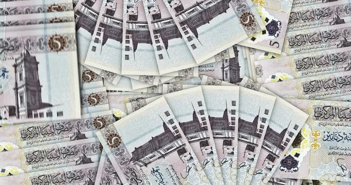 Libya Dinar banknotes in a cash fan mosaic pattern loop. Libyan LYD 5 money notes. Abstract concept of bank, finance, economy seamless and looped decorative design background.