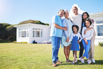 Happy family, portrait and real estate on garden grass in property, investment or moving in new home together. Parents, grandparents and kids smile in happiness for buying house, building and finance