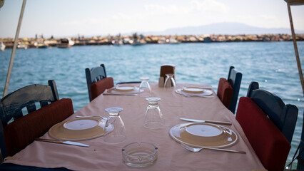 empty dining table by the sea. blue seaside restaurant