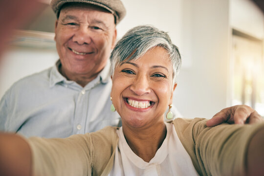 Senior couple, face and selfie in home for love, smile and relax to bond in retirement together. Portrait of happy woman, elderly man and profile picture for social media post, photography and memory