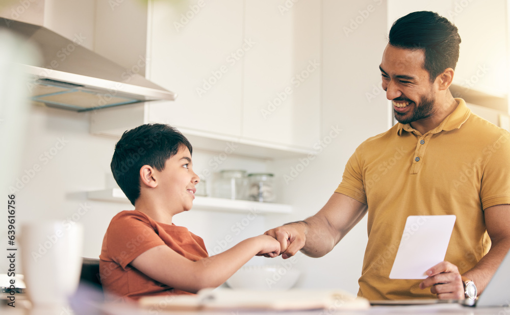 Sticker Fist bump, homework and father with child at their home in celebration of completed studying. Happy, smile and young dad bonding together with his boy kid in the kitchen of modern house or apartment.