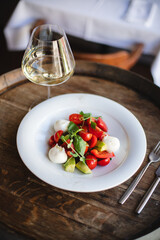 Restaurant serving dishes, waiter, banquet, set table with white tablecloth and chic dish.