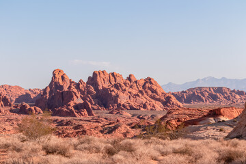 Scenic view of red and white Aztek sandstone rock formations on White Domes trail in Valley of Fire State Park, Mojave desert, Nevada, USA. Hot temperature in arid landscape on clear summer day