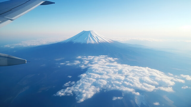 Fuji mountain view looking from airplane window, Snow covered in Autumn and Spring Season