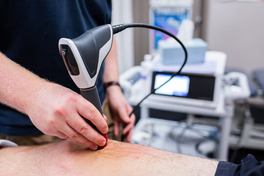 shockwave therapy to relieve pain and promote healing of injured tendons on leg