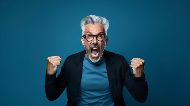 hispanic man with gray hair excited yelling