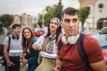 group of teenage students gen z sit in front of school university