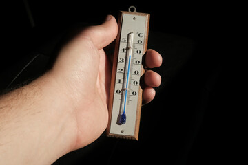 thermometer in the hand